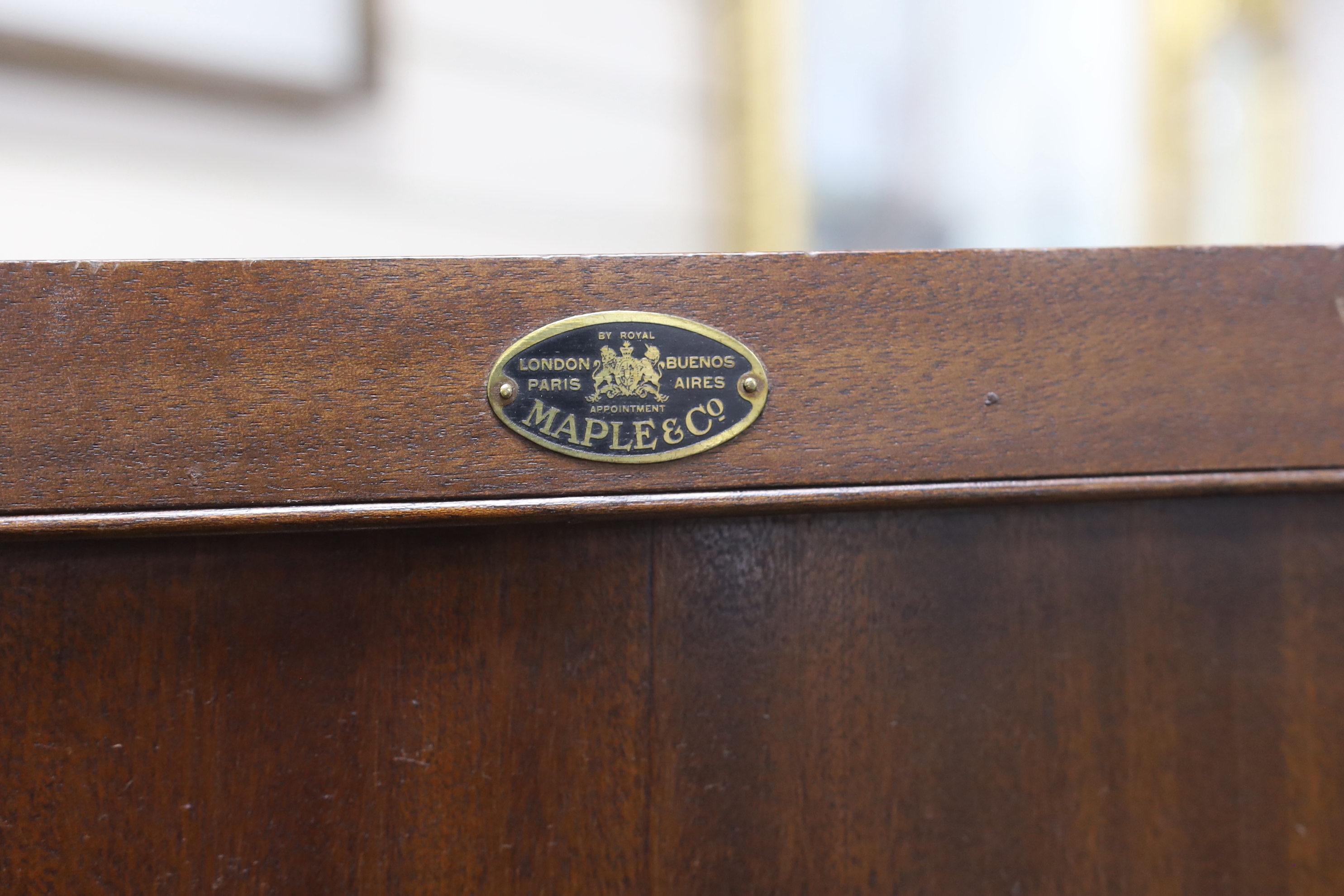 An early 20th century Maple & Co. mahogany narrow press cupboard, width 80cm, depth 45cm, height 168cm